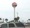 Pensacola beach water tower with sign painted on it
